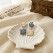 Mismatched Geometric Resin Drop Earrings.
